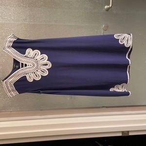 Sleeveless. Purple semi formal dress. White embroidery.